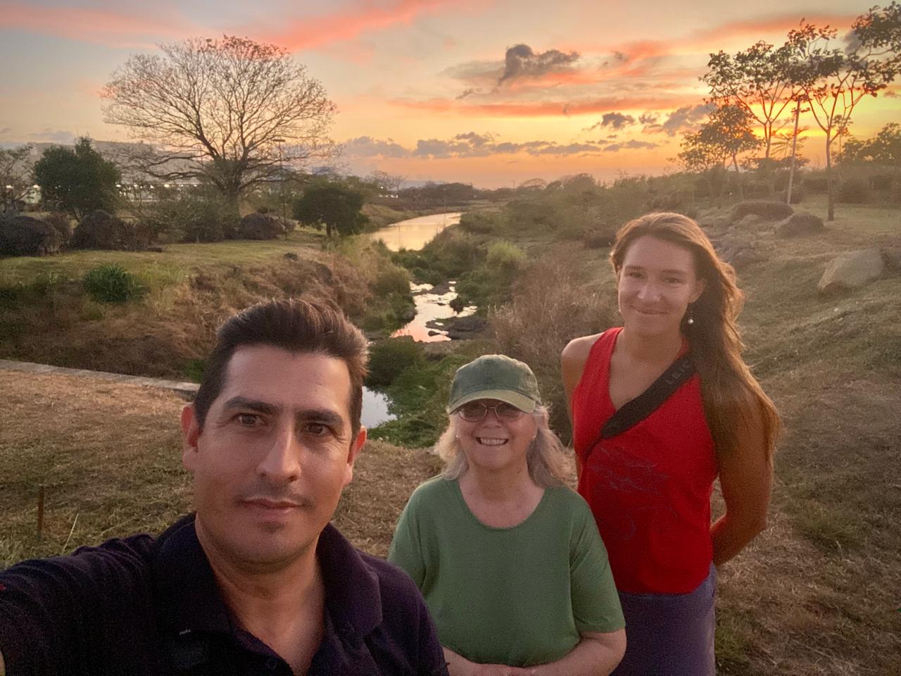 Co-owner of Hotel Robledal Emmanuel Guzmán, blog author Zoey Greenberg, and hotel guest Anne Elliot on a sunset walk through the industrial park.